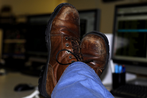 feet on work desk